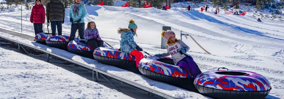 snow play inner tubing family big bear